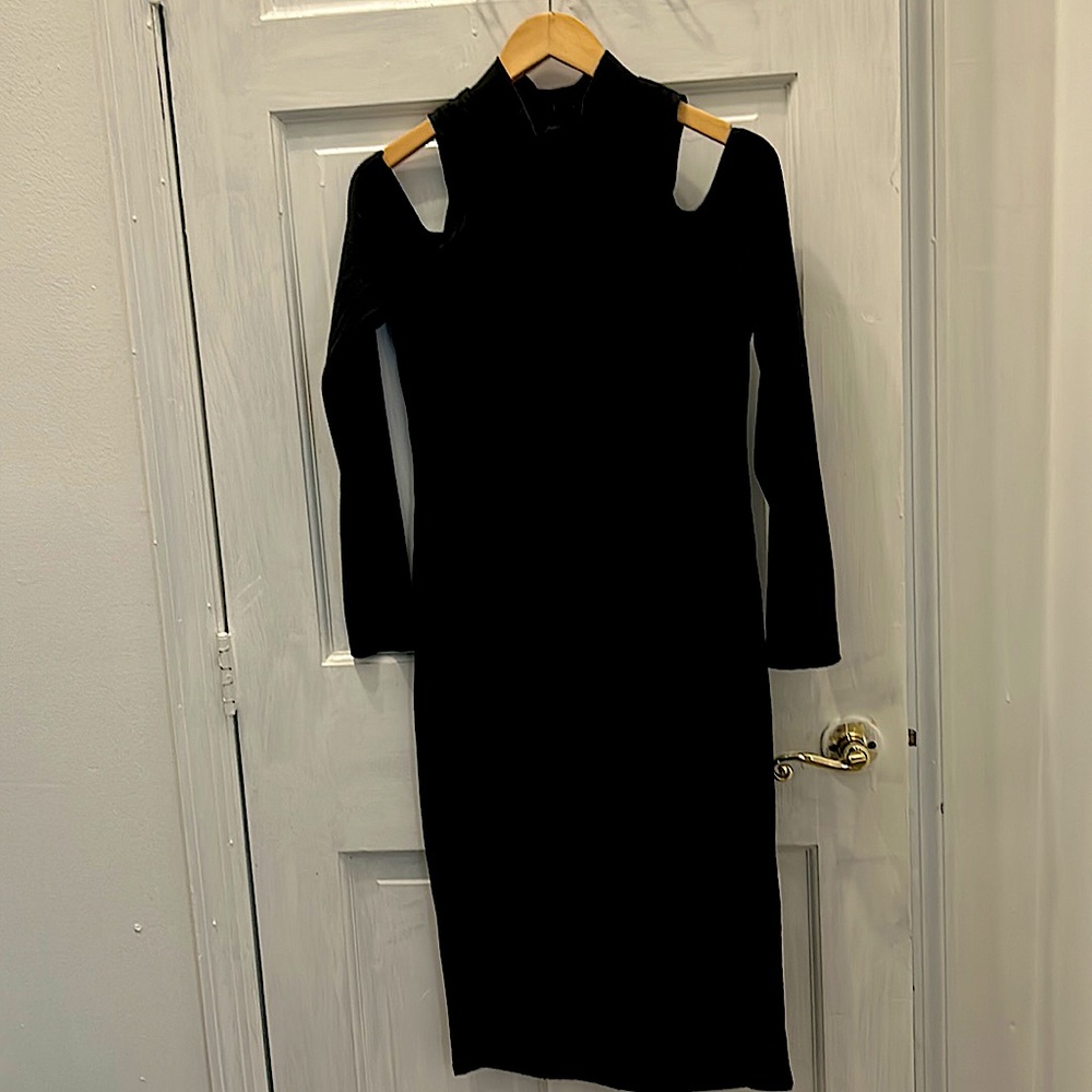 Black ribbed, cold shouldered dress. Zippered back & buttons at neckline!